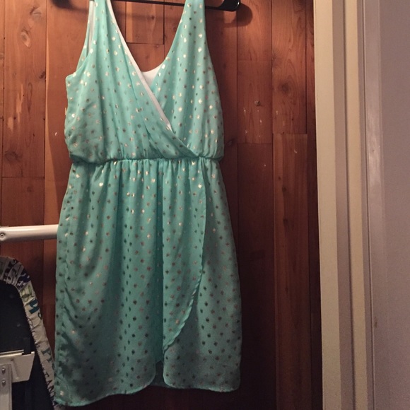 Baby blue dress with gold ish spots.