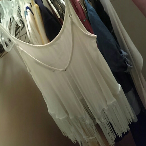 Tank with strings and the bottoms backs out