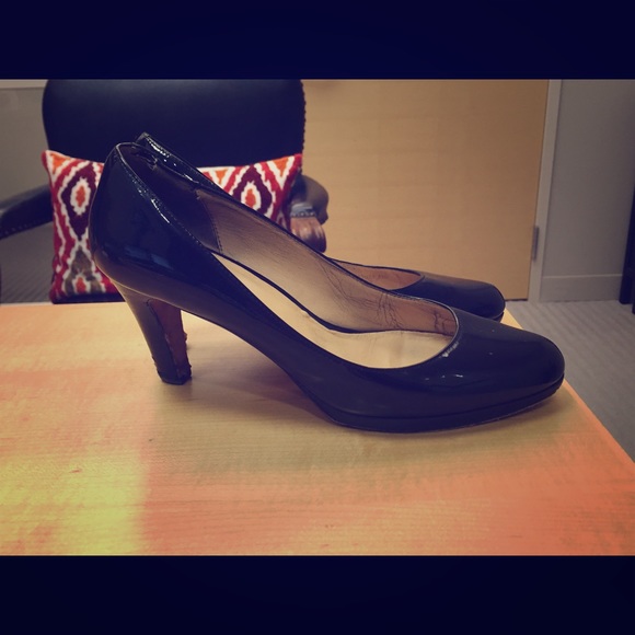 Cole Haan black patent leather pumps.