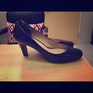 Cole Haan black patent leather pumps.