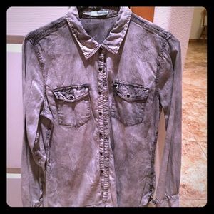 Grey chambray snap up shirt.