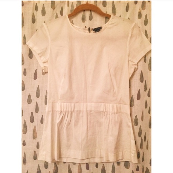 White peplum blouse with exposed zipper