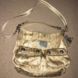 Coach Cross Body Purse. Gold