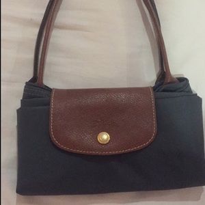 Small gunmetal color long champ bag
