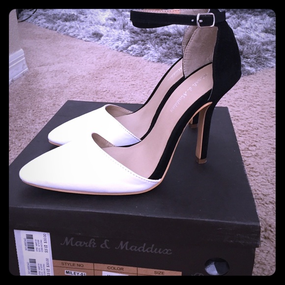 White and black pointed heels