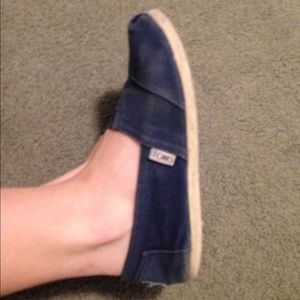 worn navy blue toms