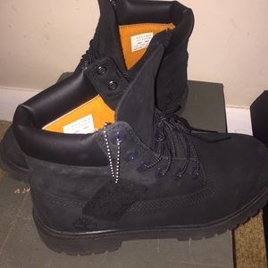 Black Timberland boots.