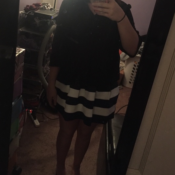 Black jacket and blue and white skirt