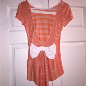 Orange top with bow