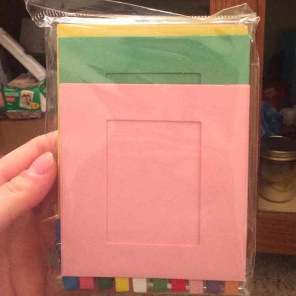 Polaroid photo frames, strong, and clips.