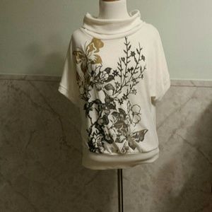 Cream thin sweater with metallic butterflies.