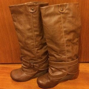 Tall brown leather buckle boots