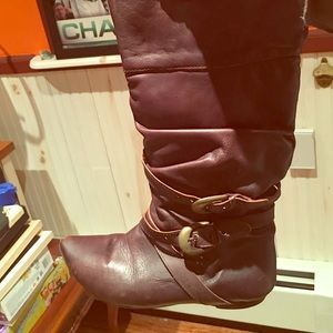 Brown flat boots with gold buckles