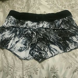Black, grey, and white run shorts