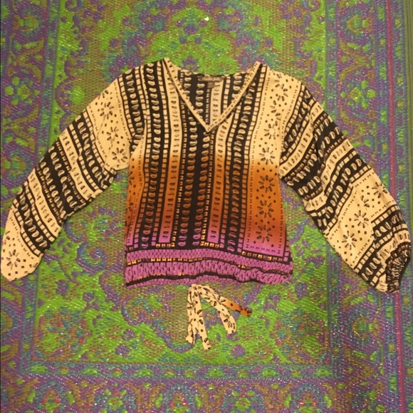 Loose blouse with ombré color and black pattern.