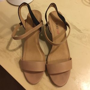 Nude and black wedges