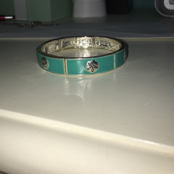 Elastic blue bracelet with silver sand dollars