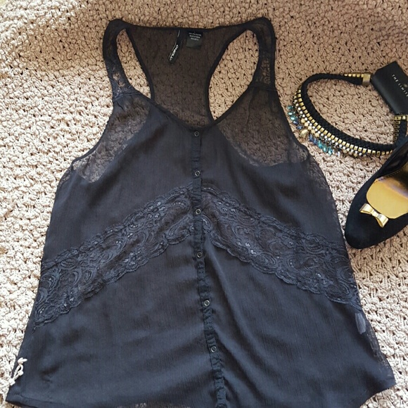 Firm. Sheer black lace detail racer back blouse