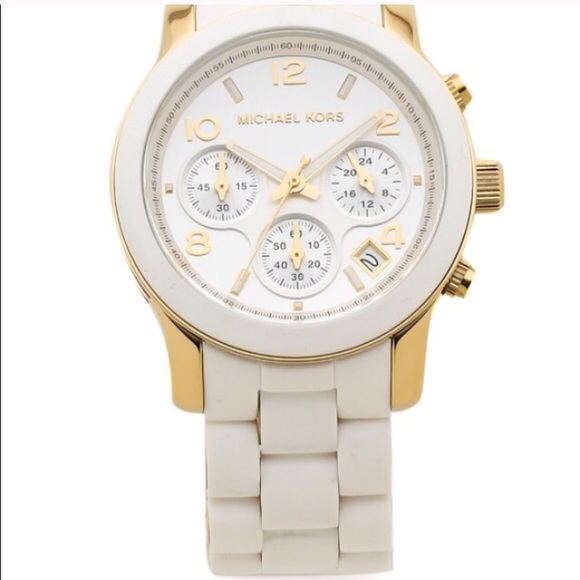 Michael Kohrs white watch with gold accents.