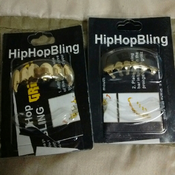 Gold plated vampire fang grills