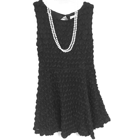 Black cocktail dress with detailed stitching