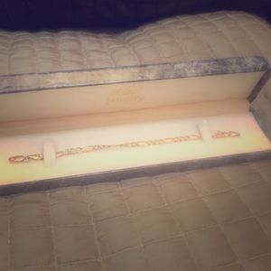 14k gold bracelet with sterling silver details.