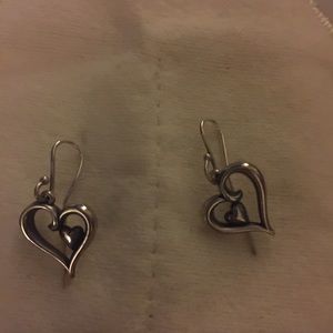 Silver heart shaped earrings.