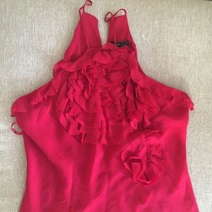 Adorable halter style tank full of flirty ruffles!