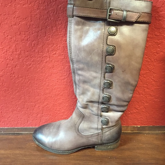 brown boots with decorative buttons