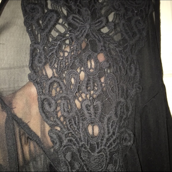 Black blouse with lace detail.