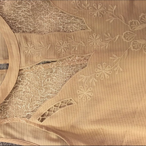 Cream colored top with lace front.