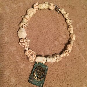 Western necklace with turquoise pendant.