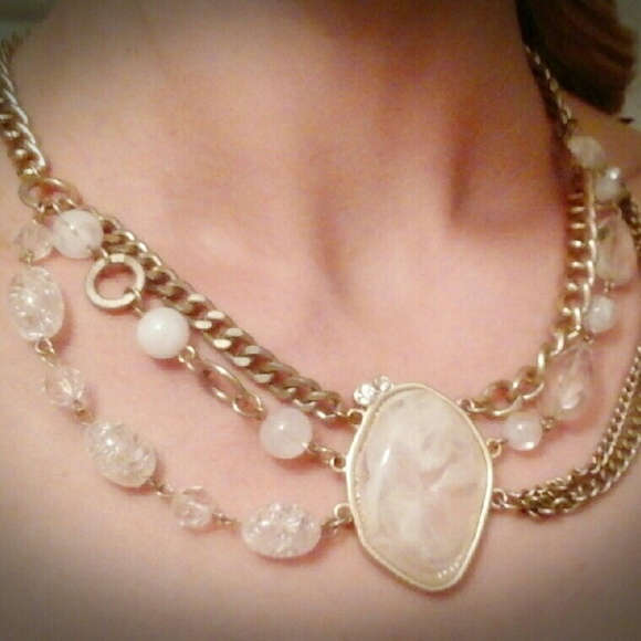 Gold necklace with white center stone