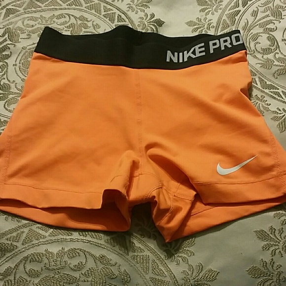 Bright orange Nike Pro shorts