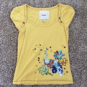 A beautiful yellow embroidered bird design top