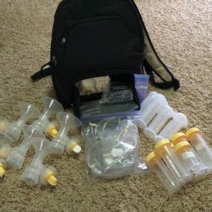 Medela backpack breast pump with tons of extras!