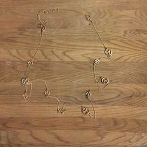 Peace sign long gold necklace