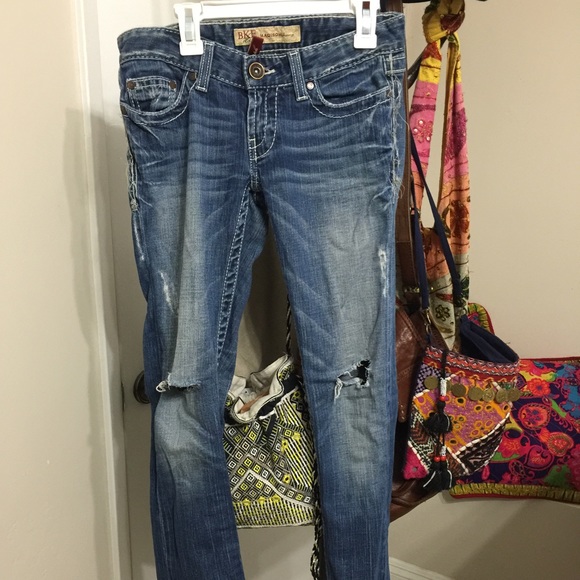 Buckle dark blue denim distressed jeans.
