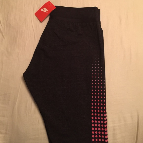 Brand NEW Nike leggings with stirrups.