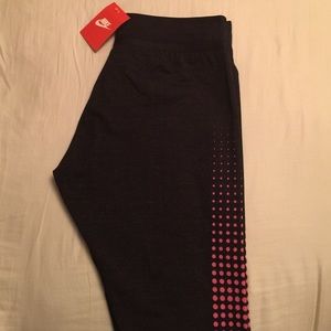 Brand NEW Nike leggings with stirrups.
