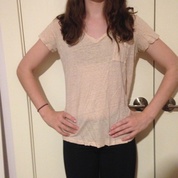 Cream colored shirt.