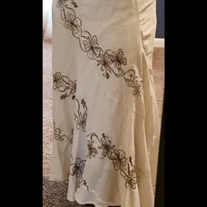 Long beige skirt size small w/ brown flower design