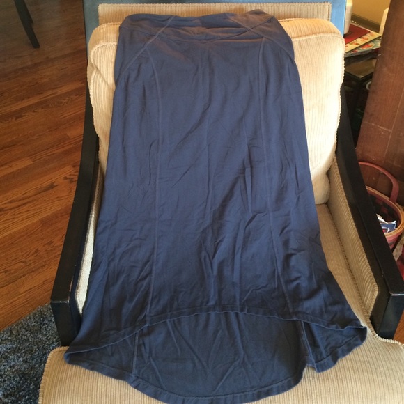 Athlete long dark gray skirt.