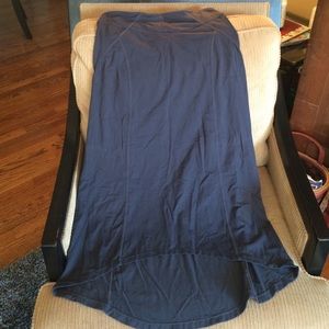 Athlete long dark gray skirt.