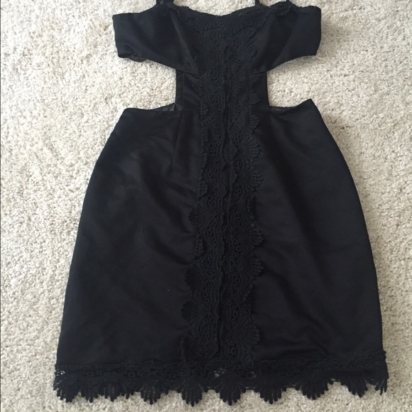 Black cutout dress with embroidery detail.