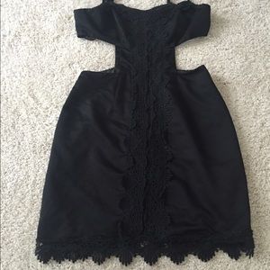 Black cutout dress with embroidery detail.