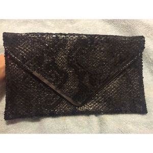 Snake print clutch in black