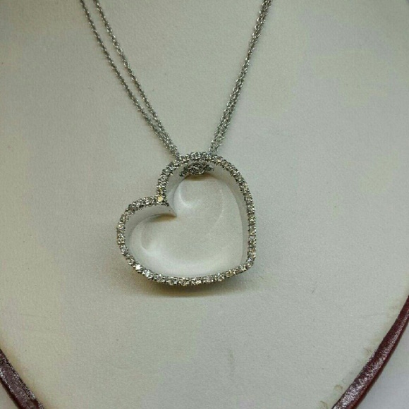 14kt white gold diamond heart necklace.