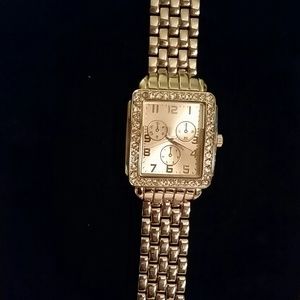 Silver tone square rhinestone watch.
