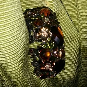 Floral amber / bronze colored cuff.